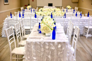 event room setup with rows of tables with chairs