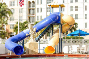 outdoor pool area waterslides and fountain