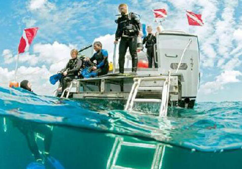 scuba diving off a boat